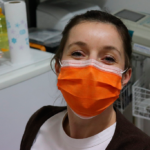 Image of a nurse sporting an orange surgical mask